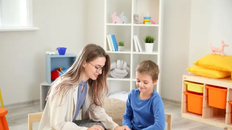 An ABA therapist working with a child at home