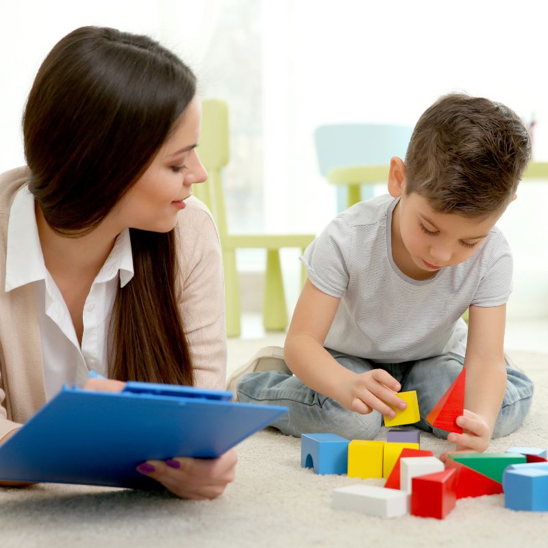 Therapist guiding a child through a sensory play session as part of ABA therapy at MindWay ABA in Carmel, Indiana, promoting engagement and joyful learning.