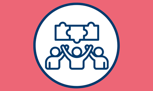 Blue and pink icon showing three people raising their arms beneath interlocking puzzle pieces, symbolizing MindWay ABA’s in-center autism therapy that fosters connection, learning, and confidence in a supportive environment.