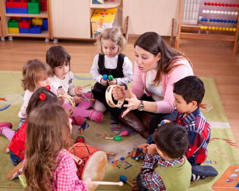 Therapist guiding young children with autism during a Montessori-inspired, multi-sensory learning activity at MindWay ABA