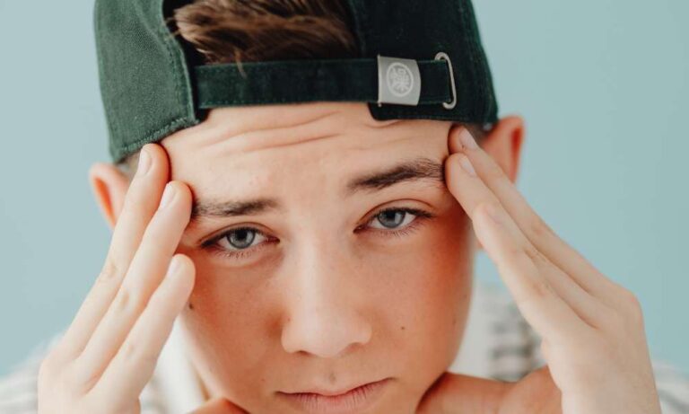 A teenage boy self-regulating during an ABA therapy session in Carmel, IN