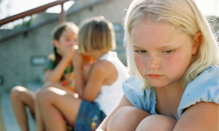 A young girl with autism struggling to fit in with her social group at school.